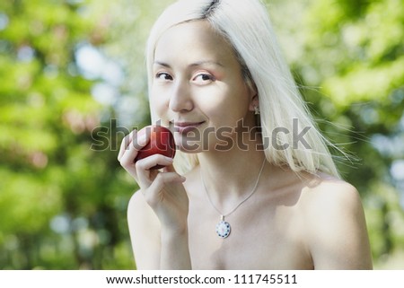 Young asian woman with perfect skin over summer background