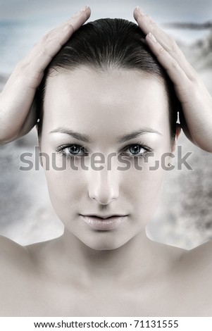 Portrait of a Beautiful young woman face with fresh clean skin on the ocean background