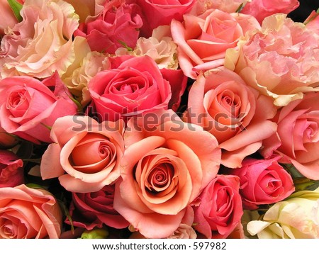 photograph of a wedding bouquet with a variety of pink roses and pink eustoma flowers