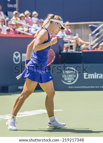 MONTREAL - AUGUST 6: Angelique Kerber of Germany in her Second round win over Caroline Garcia of USA at the 2014 Rogers Cup on August 6, 2014 in Montreal, Canada