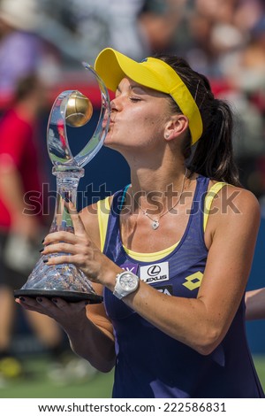 MONTREAL - AUGUST 10: Agnieszka Radwanska of Poland with her trophy after her Final game win over Venus Williams of USA at the 2014 Rogers Cup on August 10, 2014 in Montreal, Canada