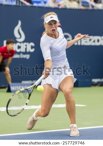 MONTREAL - AUGUST 7: Caroline Wozniacki of Denmark in her third round match win over Shelby Rogers of USA at the 2014 Rogers Cup on August 7, 2014 in Montreal, Canada
