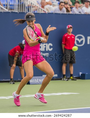 MONTREAL - AUGUST 5: Ana Ivanovic of Serbia in her second round match win over Timea Bacsinszky of Switzerland at the 2014 Rogers Cup on August 5, 2014 in Montreal, Canada
