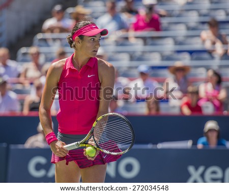 MONTREAL - AUGUST 6: Caroline Garcia of France in her Second round match against Angelique Kerber of Germany at the 2014 Rogers Cup on August 6, 2014 in Montreal, Canada