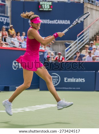 MONTREAL - AUGUST 6: Garbine Muguruza of Spain in her Second round match loss to Maria Sharapova of Russia at the 2014 Rogers Cup on August 6, 2014 in Montreal, Canada