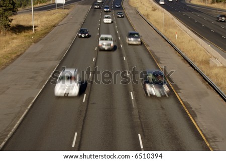 front view of fast blurred cars