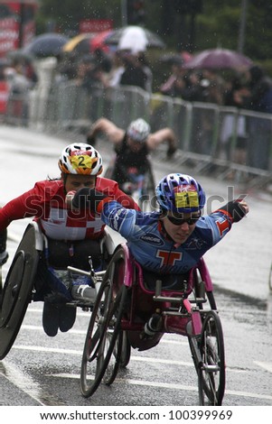 LONDON - APRIL 25: Wheelchair racing contestants in the London Marathon on April, 25, 2010 in London, UK. London Marathon is next to New York, Berlin, Chicago and Boston to the World Marathon Majors