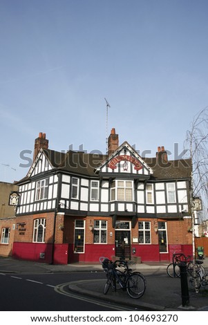 LONDON - MARCH 29: Exterior of pub, for drinking and socializing, focal point of community, on March 29, 2012, London, UK. Pub business, now about 53,500 pubs in the UK, has been declining every year