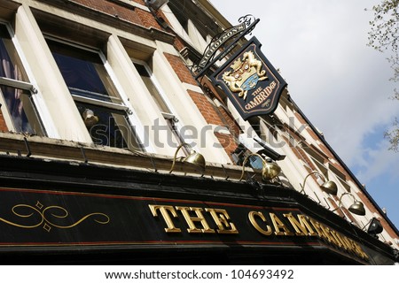 LONDON - APRIL 15: English pub sign, Public house, known as pub, is focal point of community, on April 15, 2012, London, UK. Pub business, now about 53,500 pubs in UK, has been declining every year