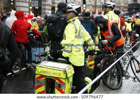 LONDON - APRIL 28 : St John Ambulance aiders, bicycles allow to move more quickly through crowds with medical equipment, at THE BIG RIDE, London Cycling Campaign, on April 28, 2012, London, UK.