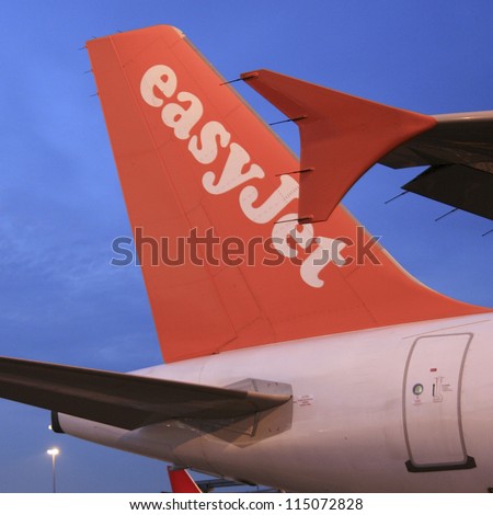 LONDON - JUNE 24 : EasyJet Airbus A319 on JUNE 24, 2012 in London, UK. EasyJet Airline, UK\'s largest airline, operates over 200 aircraft, is the second-largest low-cost carrier in Europe after Ryanair