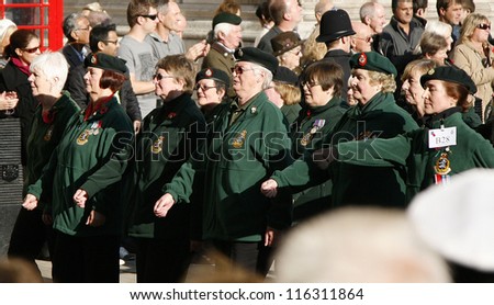 LONDON - NOV 13 : People take part in Remembrance Day, Poppy Day or Armistice Day, 11th every Nov, to remember armed forces who have died since First World War, Parade on Nov 13, 2011, London, UK.