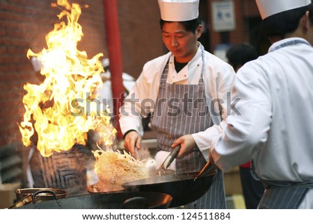 LONDON - FEB 18 : Chinese chefs working at Chinese New Year celebrations in London\'s Chinatown on Feb18, 2007, London, UK. Various traditional performance attract thousands of people to the street.