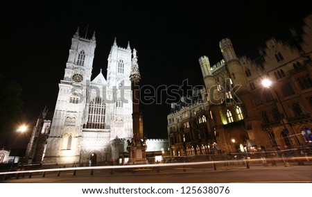 Westminster Abbey, The Great West Door and towers, and The Sanctuary seen from Tothill Street at night.