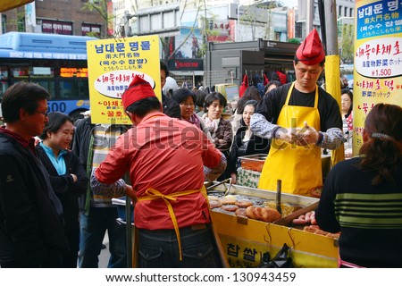 SEOUL - APRIL 21: A street food stall in Nam Dae Mun Market, crowd present, on April 21, 2011, Seoul, South Korea. This is the oldest, dates back to 1414, and largest traditional market in South Korea