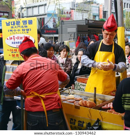 SEOUL - APRIL 21: A street food stall in Nam Dae Mun Market, crowd present, on April 21, 2011, Seoul, South Korea. This is the oldest, dates back to 1414, and largest traditional market in South Korea