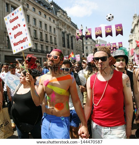 LONDON - JUNE 29: People take part in London's Gay Pride on June 29, 2013 in London, UK, estimated 25,000 people took part in the march, Parade to support gay rights.