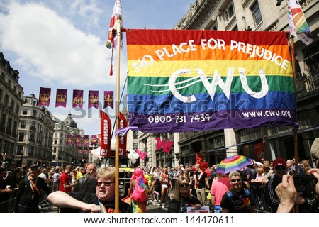LONDON - JUNE 29: People take part in London's Gay Pride on June 29, 2013 in London, UK, estimated 25,000 people took part in the march, Parade to support gay rights.