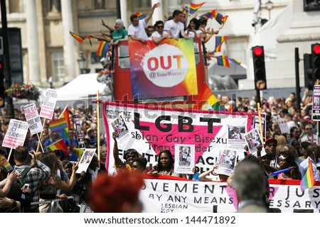 LONDON - JUNE 29: People take part in London\'s Gay Pride on June 29, 2013 in London, UK, estimated 25,000 people took part in the march, Parade to support gay rights.