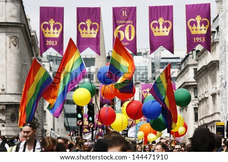 LONDON - JUNE 29: Rainbow flag in London\'s Gay Pride, on June 29, 2013 in London, UK, estimated 25,000 people took part in the march, Parade to support gay rights.