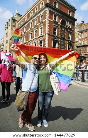 LONDON - JUNE 29: People take part in London\'s Gay Pride on June 29, 2013 in London, UK, estimated 25,000 people took part in the march, Parade to support gay rights.