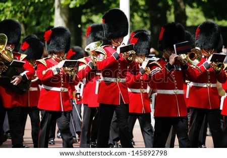 LONDON - JUNE 15: Queen\'s Soldier at Queen\'s Birthday Parade on June 15, 2013 in London, UK. Queen\'s Birthday Parade take place to Celebrate Queen\'s Official Birthday in every June in London.