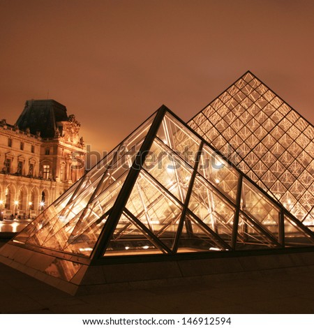 PARIS - SEP 24 : Night view of the Louvre, glass pyramid present, world\'s largest museums, most visited museum, more than 8 million visitors per year, opened from 1793 on Sep 24, 2010, Paris, France.