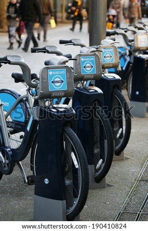 LONDON - MARCH 1: Rental bicycles on March 1, 2014, London, UK. London\'s bicycle sharing scheme, launched with 6000 bikes, 400 docking stations on 30 July 2010 to help ease traffic congestion.