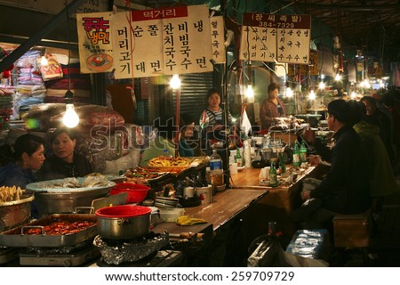 SEOUL - MAY 11: Street view of Nam Dae Mun Market, crowd present, on May 11, 2011, Seoul, South Korea. This is the oldest, dates back to 1414, and largest traditional market in South Korea