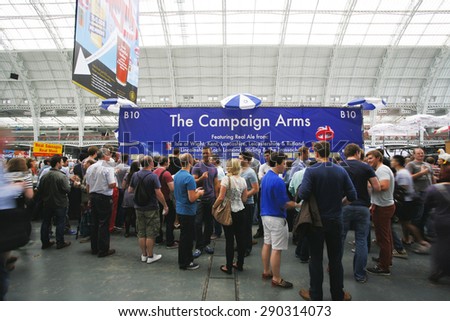 LONDON - AUGUST 17: Great British Beer Festival, at Kensington Olympia, Britain\'s biggest beer festival on Aug 17, 2013 in London, UK. Visitors can try wide range of real ales, ciders, perries.