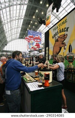 LONDON - AUGUST 17: Great British Beer Festival, at Kensington Olympia, Britain's biggest beer festival on Aug 17, 2013 in London, UK. Visitors can try wide range of real ales, ciders, perries.