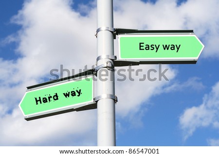 Street post with Easy way, Hard way signs.