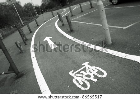 Bicycle lane with white mark of bicycle sign, London.