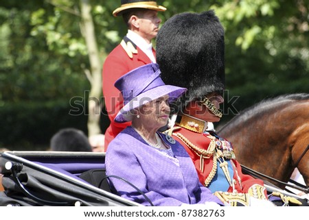 LONDON - JUNE 17: Queen Elizabeth II and Prince Philip seat on the Royal Coach at Queen\'s Birthday Parade on June 17, 2006 in London, England.