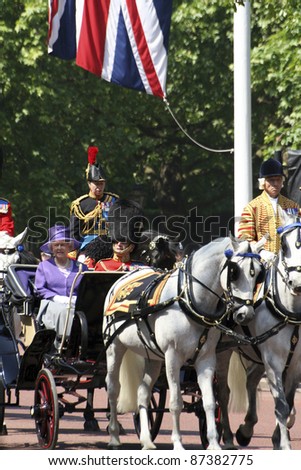 LONDON - JUNE 17: Queen Elizabeth II and Prince Philip seat on the Royal Coach at Queen's Birthday Parade on June 17, 2006 in London, England.