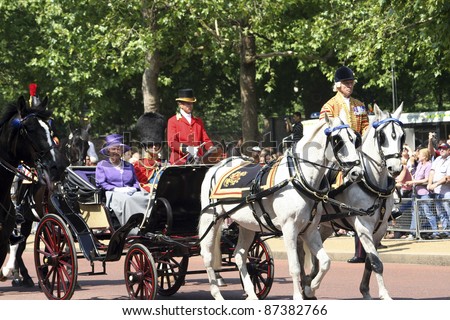 LONDON - JUNE 17: Queen Elizabeth II and Prince Philip seat on the Royal Coach at Queen\'s Birthday Parade on June 17, 2006 in London, England.