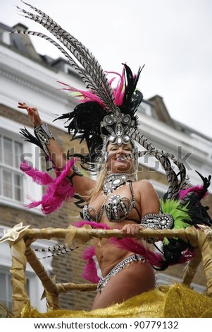 LONDON - AUGUST 29: Performers take part in the second day of Notting Hill Carnival, largest in Europe, on August 29, 2011 in London, UK. Carnival takes place over two days in every August.