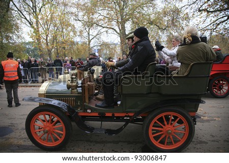 LONDON - NOVEMBER 07: London to Brighton Veteran Car Run participants leaving Hyde Park, the event starts at 7:00am at the Serpentine Road in Hyde Park on November 07, 2010 in London, UK.