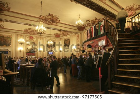 LONDON - NOV 04: Interior of pub, for drinking and socializing, focal point of the community, on Nov 04, 2010, London, UK. Pub business, now about 53,500 pubs in the UK, has been declining every year