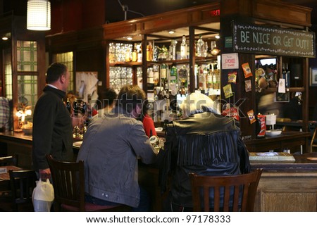 LONDON - MAY 7: Interior of pub, for drinking and socializing, focal point of the community, on May 7, 2010, London, UK. Pub business, now about 53,500 pubs in the UK, has been declining every year