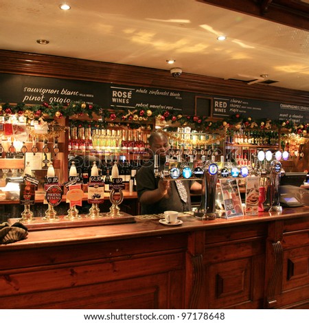 LONDON - DEC 1: Interior of pub, for drinking and socializing, focal point of the community, on Dec 1, 2010, London, UK. Pub business, now about 53,500 pubs in the UK, has been declining every year