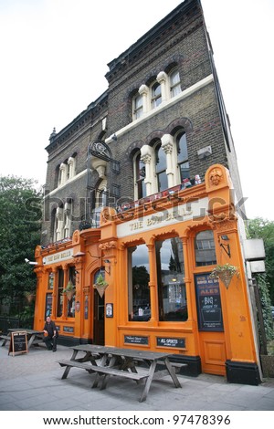 LONDON - AUG 19: Exterior of pub, for drinking and socializing, focal point of the community, on Aug 19, 2010, London, UK. Pub business, now about 53,500 pubs in the UK, has been declining every year