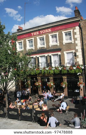 LONDON - JULY 21: Exterior of pub, for drinking and socializing, focal point of the community, on July 21, 2010, London, UK. Pub business, now about 53,500 pubs in UK, has been declining every year
