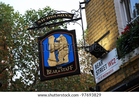 LONDON - NOV 6: English pub sign, Public house, known as pub, is focal point of the community, on Nov 6, 2010, London, UK. Pub business, now about 53,500 pubs in UK, has been declining every year