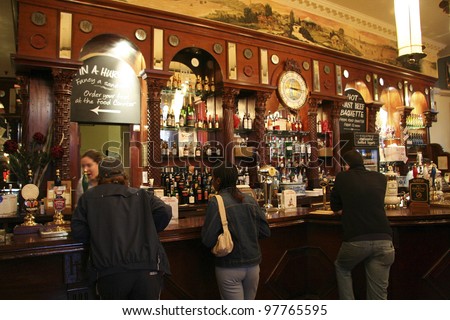 LONDON - JUNE 3: Inside view of pub, for drinking and socializing, focal point of the community, on June 3, 2006, London, UK. Pub business, now about 53,500 pubs in UK, has been declining every year