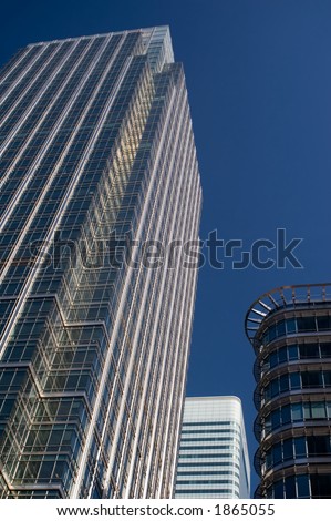 Skyscraper office building against dark blue sky background