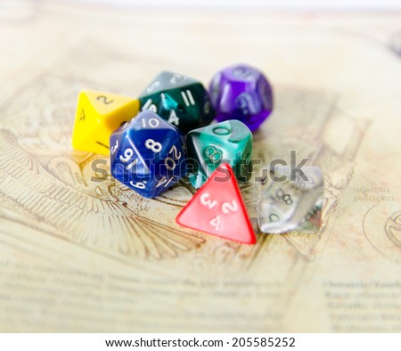 role playing dices lying on picture background - stock photo