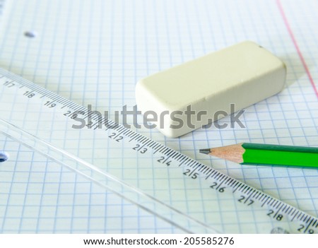 set of exercise book, pencil, rubber and ruler - school set - stock photo