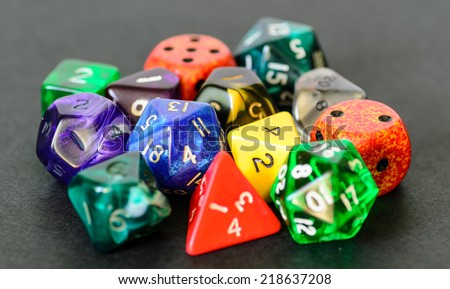 role playing dices lying on black background - stock photo