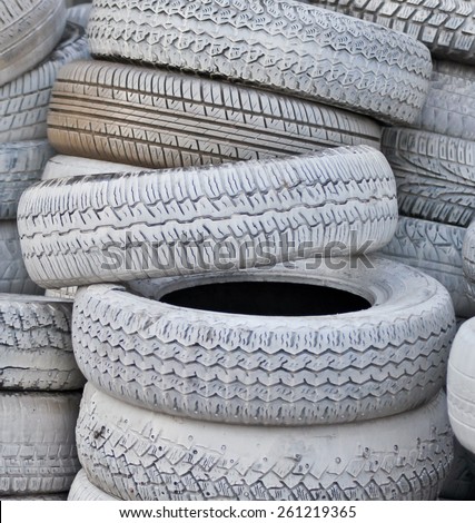 close-up. the white automobile tires dumped in a a big pile